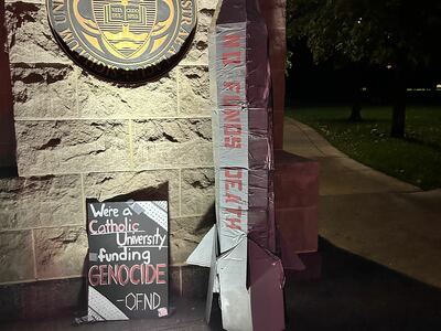 Occupation Free ND Installs Cardboard Bomb in Protest at Main Gate