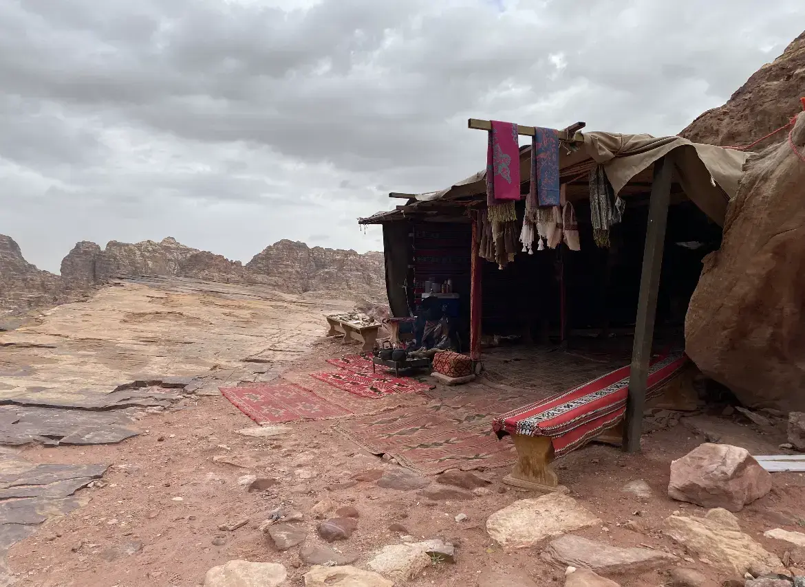 A Bedouin tent and tea stall along a cliffside trail at Petra.